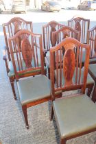 A set of eight Edwardian figured mahogany splat back dining chairs with drop-in seats, on turned and