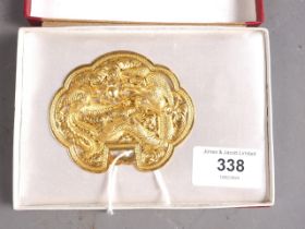A Chinese yellow metal cloud-shaped pendant with pierced and engraved decoration of two dragons