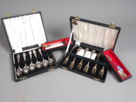 A set of six Continental white metal cocktail forks, marked 800, two similar spoons and a set of