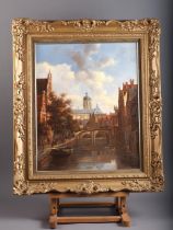 G Schroter: an oil on panel, Dutch town scene with canal, 19 1/2" x 15 1/2", in gilt frame