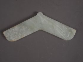 A Chinese pale celadon jade angular pendant, decorated two dragons, 6 3/4" wide