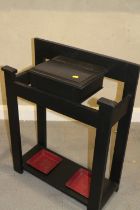 An ebonised stick stand with glove box, 23" wide x 10" deep x 30" high