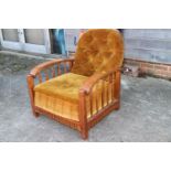 A Liberty type oak frame fireside recliner armchair with loose seat and back cushions, in a snuff