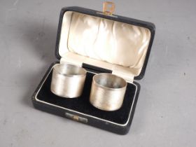 A pair of silver napkin rings, in box, 2.2oz troy approx