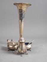 A silver three-piece cruet, 3.2oz troy approx, and a silver trumpet vase, on weighted base