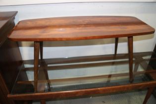 A 1950s walnut oval low coffee table, on splay supports, 37" wide x 15" deep x 14 1/2" high