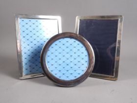 Three modern silver photograph frames, various