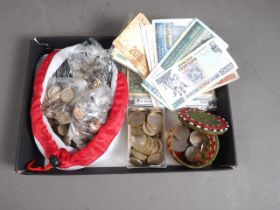 A collection of British and world coins and banknotes, including Euros, US Dollars, collectors £2