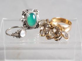 An Indian yellow metal and smoky quartz ring, size Q, 10g, and two silver stone set dress rings