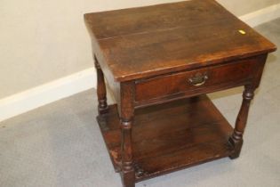 An oak low two-tier occasional table, fitted drawer, on turned supports, 23" wide x 18 1/2" deep x