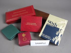 A large collection of coin and presentation medallion boxes