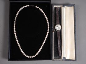 A string of Ciro pearls, in case, and a lady's wristwatch, in case
