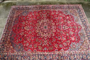 A vintage Persian Tabriz carpet with floral design on a multi ground, 124" x 72" approx