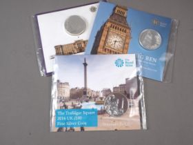 Three Royal Mint UK £100 fine silver commemorative coins, Trafalgar Square, Big Ben and Buckingham