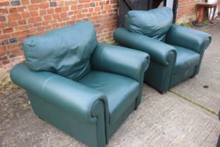 A pair of green leather two-seat settees and a pair of matching armchairs