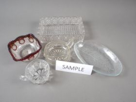 A collection of 19th century and early 20th century press moulded glass dishes, bowls, cups, etc