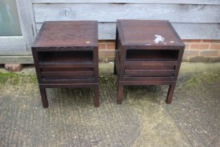 A pair of modern ebonised two-tier lamp tables, fitted one drawer, on square supports, 17 1/2"
