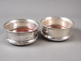 A pair of silver bottle coasters with mahogany bases, 4 1/2" dia