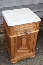 A late 19th century French marble top bedside cupboard, fitted one drawer over one door, on castored