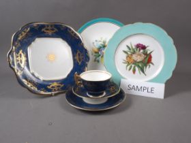 A 19th century hand-painted part dessert service with floral decoration and shaped border, another