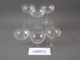 A set of nine early 20th century etched glass champagne coupes and nine others (4+5)