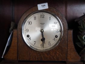 A 1950s oak cased mantel clock by Kirner Bros Oxford with eight-day striking and chiming