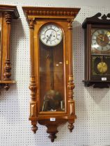 A 19th century walnut cased Vienna regulator type wall clock with enamel dial, 42" high