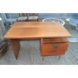 A 1960s teak single pedestal desk, fitted two drawers, 43" wide x 27 1/2" deep x 28 3/4" high