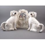 A pair of Staffordshire dogs, 12" high, (one with glass eye missing) and another Staffordshire flat