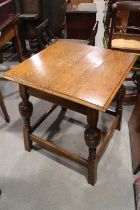 An oak square occasional table, on turned supports, 24" square x 27" high