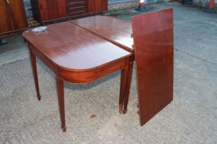 An early 19th century mahogany, box and ebony strung extending dining table, fitted frieze drawer,