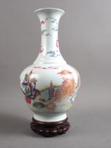 A Chinese porcelain famille rose bulbous vase, decorated figure and Kylin with bats and clouds, seal