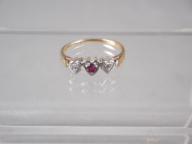 An 18ct gold, platinum, diamond and ruby sweetheart ring, size M, 2.1g