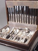 A silver plated table canteen and other flatware, servers, etc