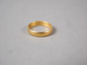 A 22ct gold wedding band, size L, 3.8g