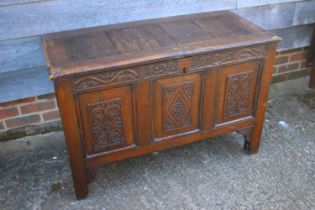 An early 18th century carved oak triple panel front coffer, on stile supports, dated 1720, 42"