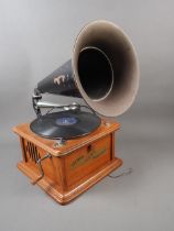 A reproduction record player with horn and built in cassette player