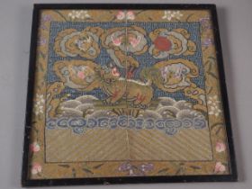 An antique Chinese embroidered Mandarin rank badge, 11" x 10 1/2", in ebonised strip frame