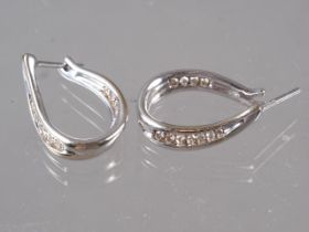 A pair of 9ct white gold and diamond earrings, 4.2g