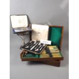 A selection of silver plate comprising two canteens of cutlery, three boxed sets of cutlery,