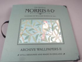 Two William Morris & Co "Archive Wallpaper" sample books, one celebrating "150 Years of Design" (one