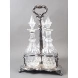 A Victorian silver plated three-decanter tantalus with contemporary decanters, 15 1/2" high (one