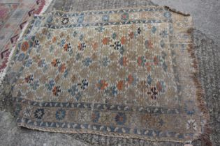 A Persian tribal rug with all-over geometric design, on a cream ground, 52" wide x 42 1/2" deep