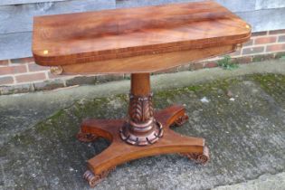 A 19th century figured mahogany fold-over top card table, on acanthus carved column, quadruple