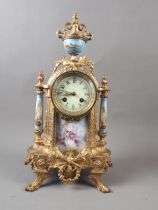 A 19th century French gilt metal and porcelain panel figure decorated mantel clock, 19 1/2" high (