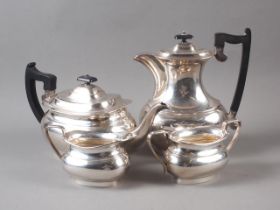 A silver four-piece teaset with ebonised knobs and handles, 56.2oz troy approx