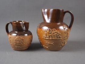 A Doulton Lambeth hunting jug, 5 1/4" high, and a larger similar jug, 7 1/2" high
