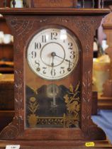 An American walnut mantel/shelf clock with Aesthetic mount gilt decorated door, striking on bell and