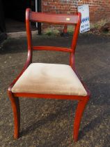 A set of four mahogany bar back dining chairs, on sabre leg supports