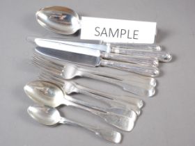 A canteen of silver fiddle pattern flatware for twelve, comprising dinner knives and forks,